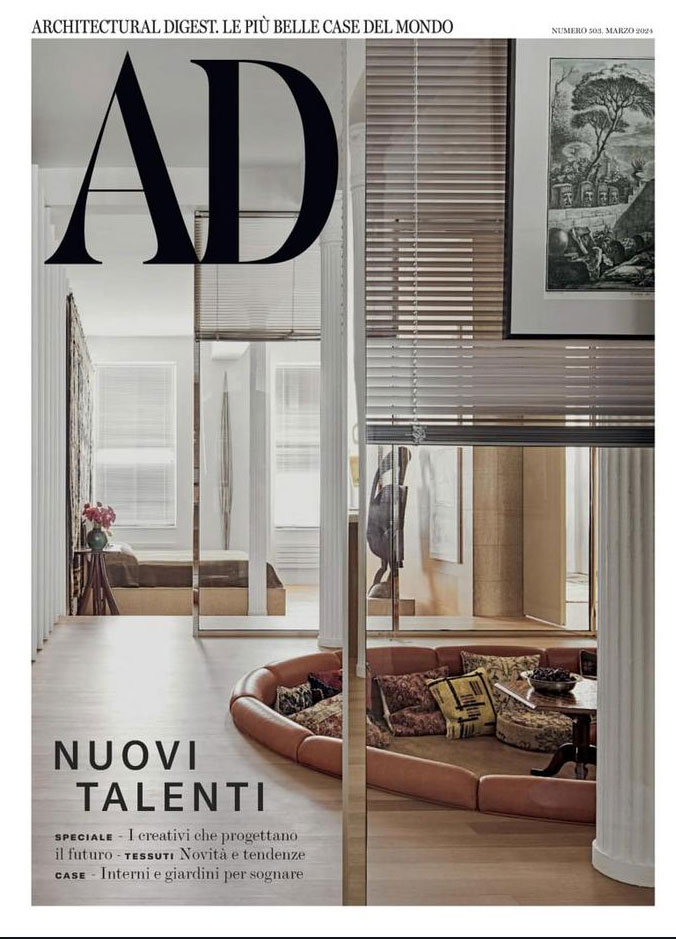 Cover of Architectural Digest Italian edition, featuring a large 'AD' logo, the headline 'NUOVI TALENTI,' and a sophisticated interior with a circular sectional sofa and elegant decor. Text overlay includes 'LE PIÙ BELLE CASE DEL MONDO' and highlights on creative future planning, textile trends, and dreamy interiors.